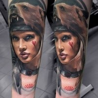 Neo traditional style colored forearm tattoo of woman face with bear