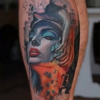 Neo traditional style colored leg tattoo of woman face with lettering