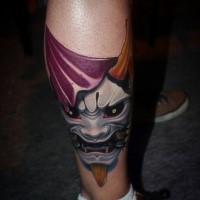 Neo traditional style colored leg tattoo of Asian mask with horns