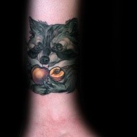 Neo traditional style colored leg tattoo of raccoon with peaches