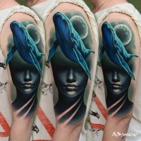 Neo traditional style colored shoulder tattoo of big whale and woman face