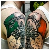 Neo traditional style colored shoulder tattoo of Irish flag with cross and clover