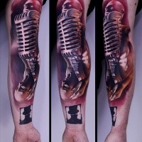 Neo traditional style colored sleeve tattoo of musician with microphone