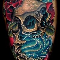 Neo traditional style colored tattoo of human skull with blue heart