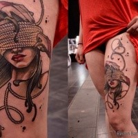 Neo traditional style colored thigh tattoo of woman with roped eyes