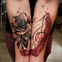 New school illustrative style colored forearm tattoo of rose flower and music symbol