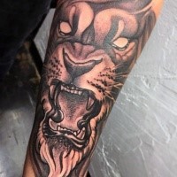 New school illustrative style forearm tattoo of lion face