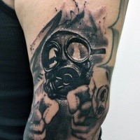 New school style black and white man in gas mask tattoo on shoulder stylized with pistols