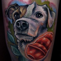 New school style colored arm tattoo of cute dog with little toy