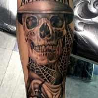 New school style colored arm tattoo of skeleton with hat and lettering