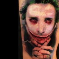 New school style colored arm tattoo of creepy man