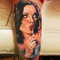 New school style colored arm tattoo of woman with lollypop