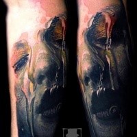 New school style colored arm tattoo of creepy looking woman face