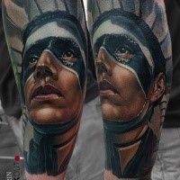 New school style colored arm tattoo of tribal human with mask