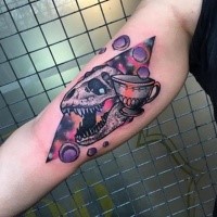 New school style colored biceps tattoo of of dinosaur skull with asteroids