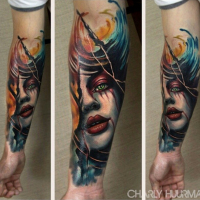 New school style colored bloody woman face tattoo on forearm