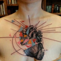 New school style colored chest tattoo of human heart with ornaments