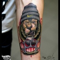 New school style colored forearm tattoo of thigh dog with brass knuckles
