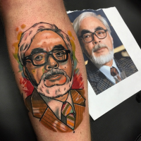 New school style colored forearm tattoo of Asian man portrait