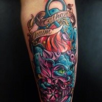 New school style colored forearm tattoo of demonic cat with lettering