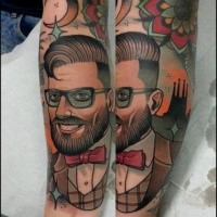 New school style colored forearm tattoo of man with glasses