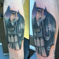 New school style colored forearm tattoo of Batman head stylized with night city