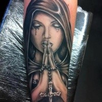 New school style colored forearm tattoo of mystical praying woman