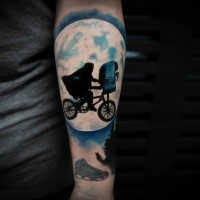 New school style colored forearm tattoo of man with flying bicycle