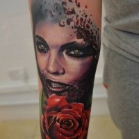 New school style colored forearm tattoo of bloody woman with rose