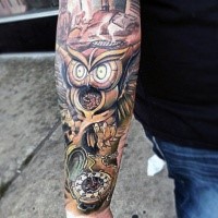 New school style colored forearm tattoo of owl with old clock