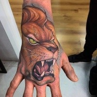 New school style colored hand tattoo of angry lion