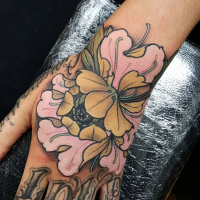 New school style colored hand tattoo of cute flower and lettering
