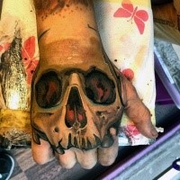 New school style colored hand tattoo of human skull