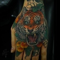 New school style colored hand tattoo of tiger with berries