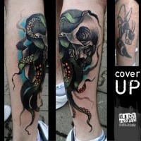 New school style colored human skull with octopus legs tattoo