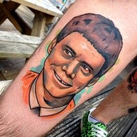 New school style colored leg tattoo of Jim Cary portrait