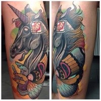 New school style colored leg tattoo of unicorn with human hand