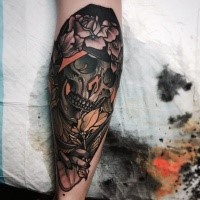 New school style colored leg tattoo of fantasy skull with flowers