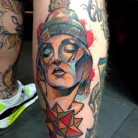 New school style colored leg tattoo of woman face with ornaments and hat