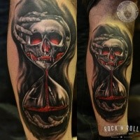 New school style colored leg tattoo of creepy clock with bloody skull
