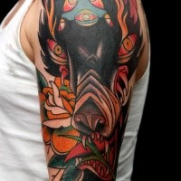 new school style colored shoulder tattoo of demonic wolf with flowers