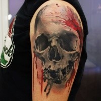 New school style colored shoulder tattoo of human skull and blood