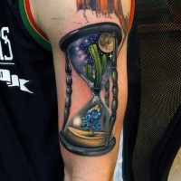 New school style colored shoulder tattoo of big sand clock with cactus and small flower