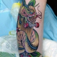 New school style colored snake with skateboard tattoo on leg