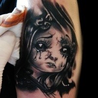 New school style colored style colored shoulder tattoo of crying doll