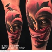 New school style colored tattoo of woman in mask with feather