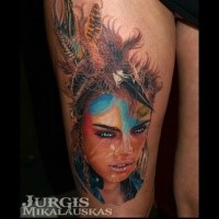 New school style colored thigh tattoo of woman with feather in hair