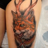 New school style colored thigh tattoo of fantasy fox with horns