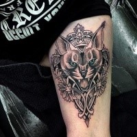 New school style colored thigh tattoo of caracal with flowers