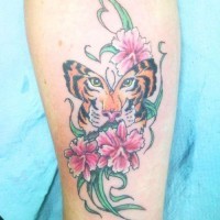 New tiger face butterfly colored tattoo on forearm with flowers